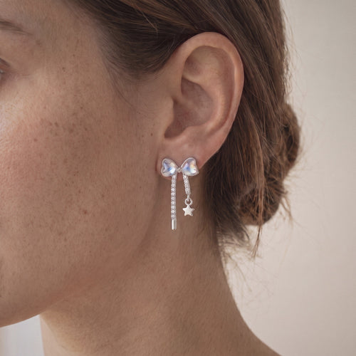 Bow Earrings in 925 Sterling Silver, Pastel Crystal with Star Drop - worn on the ear