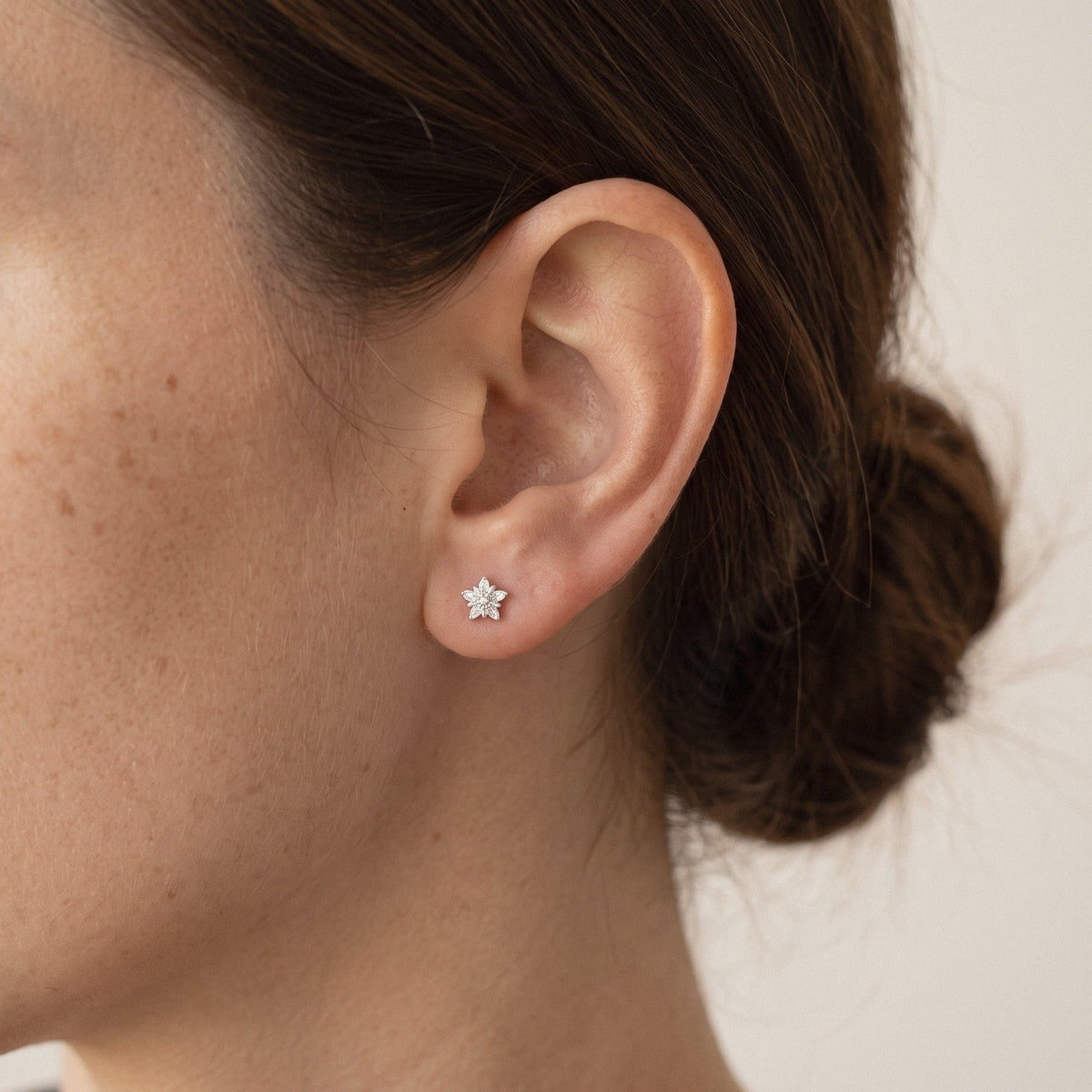 Star Stud Earrings in 925 Sterling Silver, Cubic Zirconia - worn on the ear
